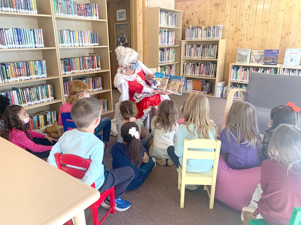 Red River Valley Kids sit for a group reading